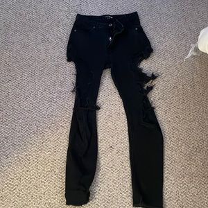 Fashion Nova size three black ripped skinny jeans.